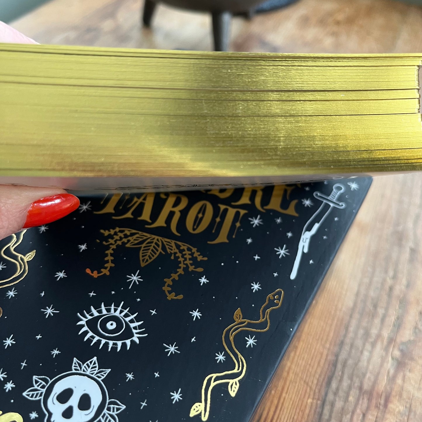 Close-up of a tarot deck with gilded edges 