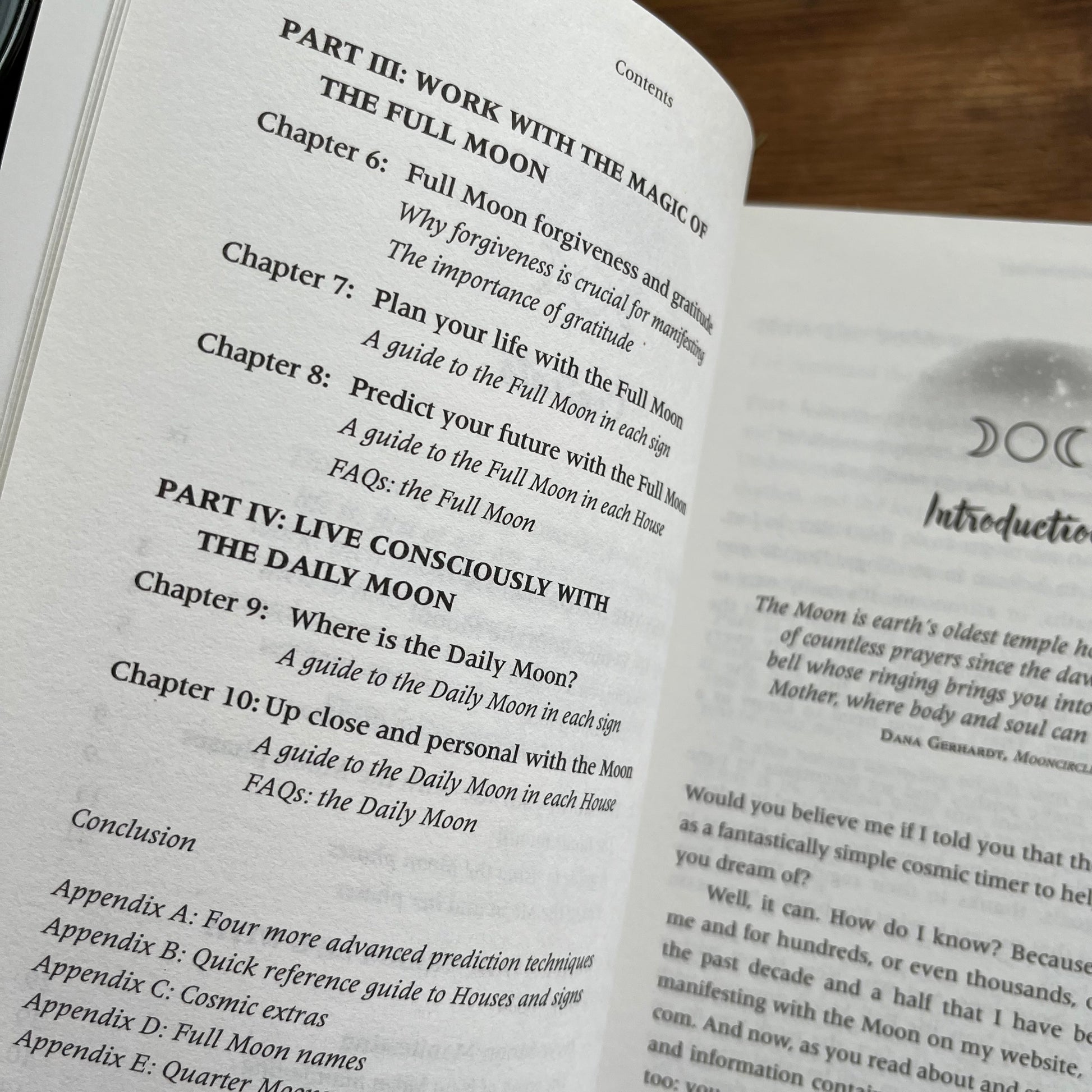 An open book showing printed text about the Full Moon and Daily Moon, with one page titled 'Part III: Work with the Magic of the Full Moon' and another page partially visible at the right.