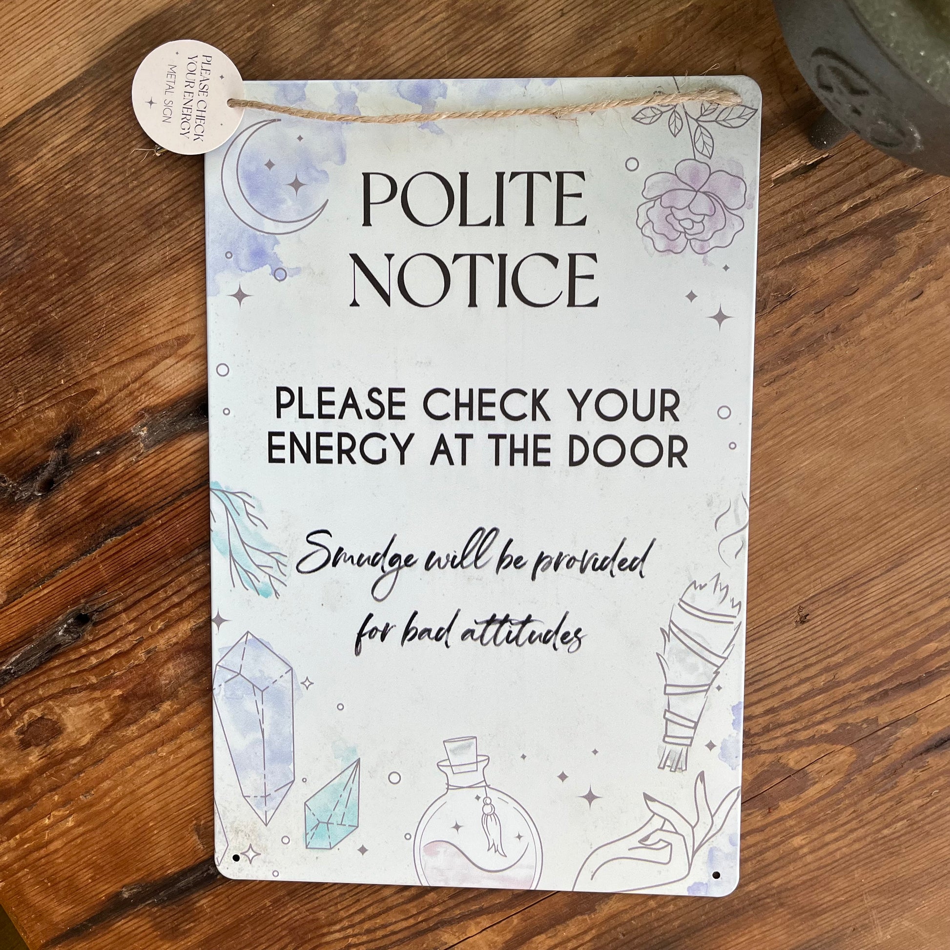 Witchy wall hanging a Polite notice to check your energy on a wooden surface 