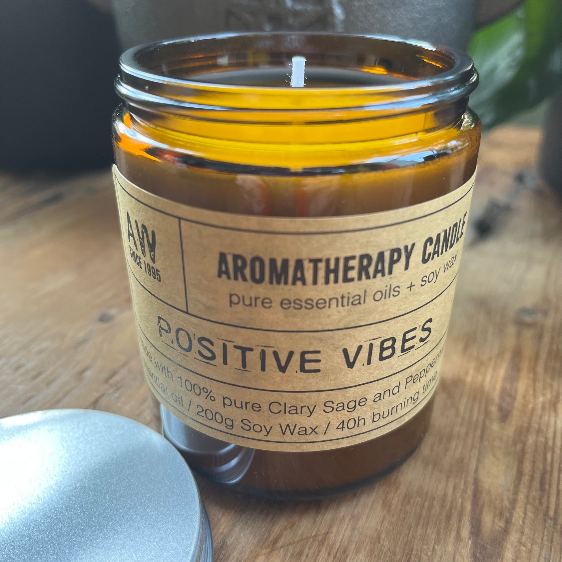 Positive vibes aromatherapy candle in a lidded glass jar 