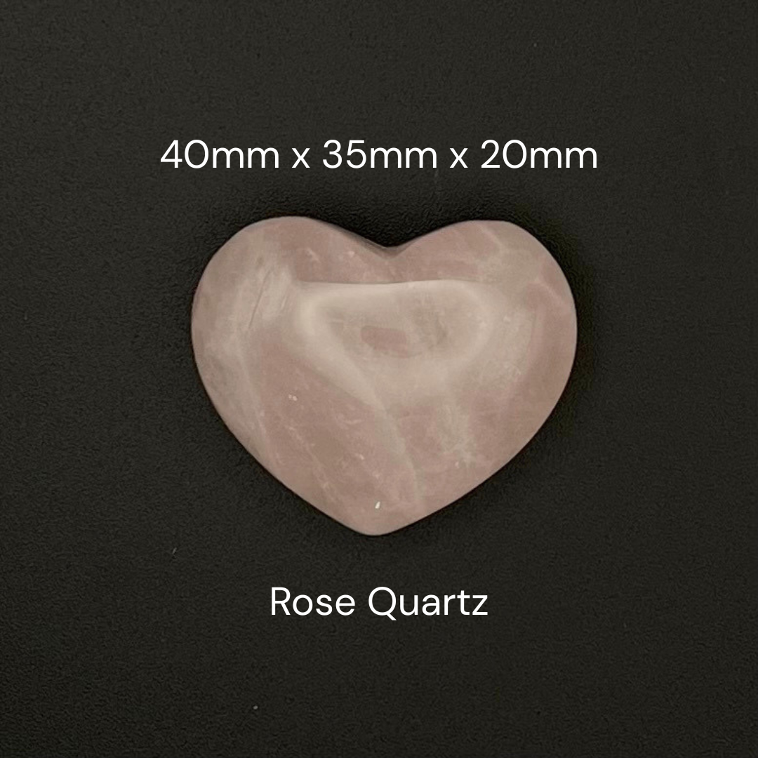 A heart-shaped rose quartz stone with dimensions labeled as 40mm x 35mm x 20mm, shown on a dark background with 'Rose Quartz' text below.