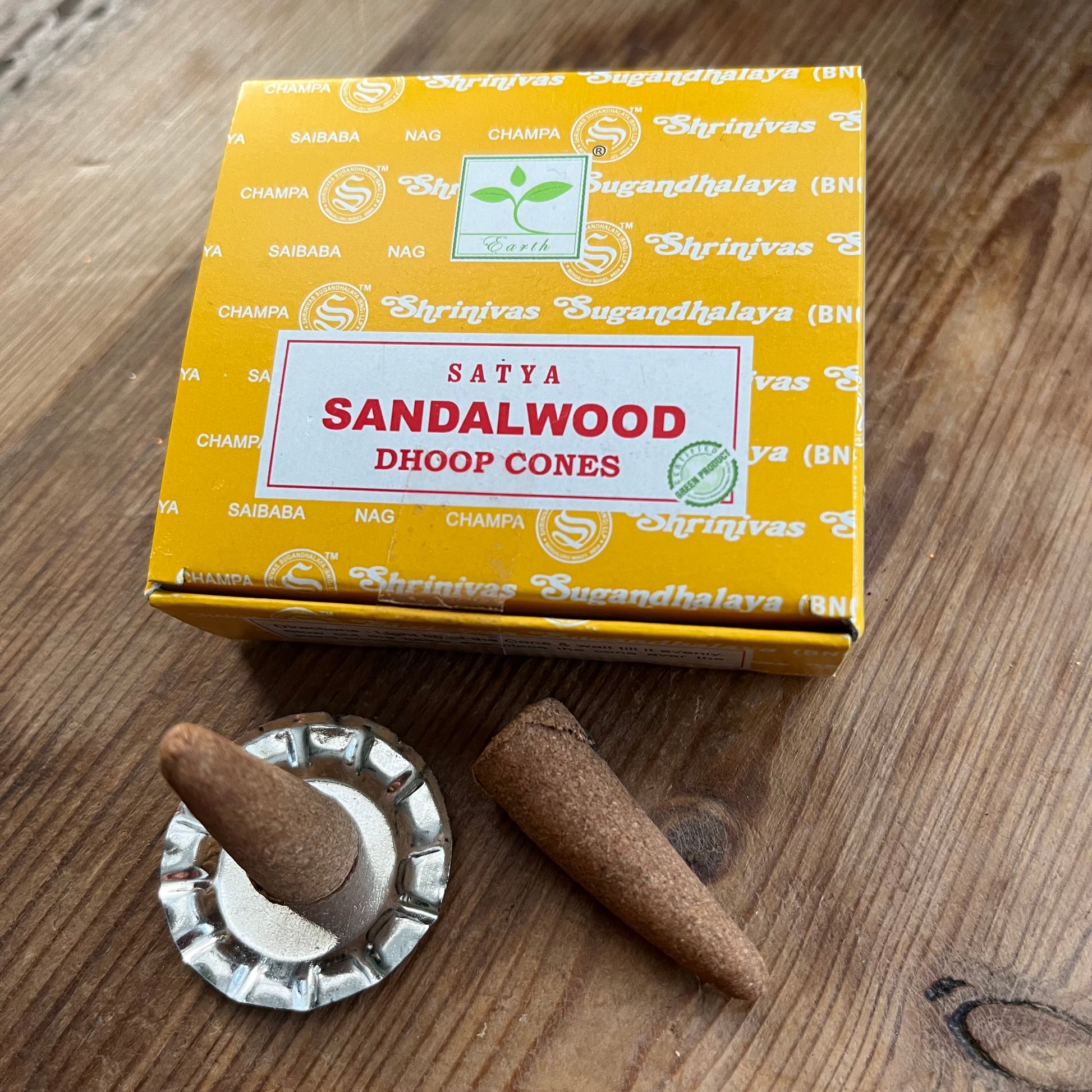 Box of Satya Sandalwood Dhoop incense cones on wooden surface