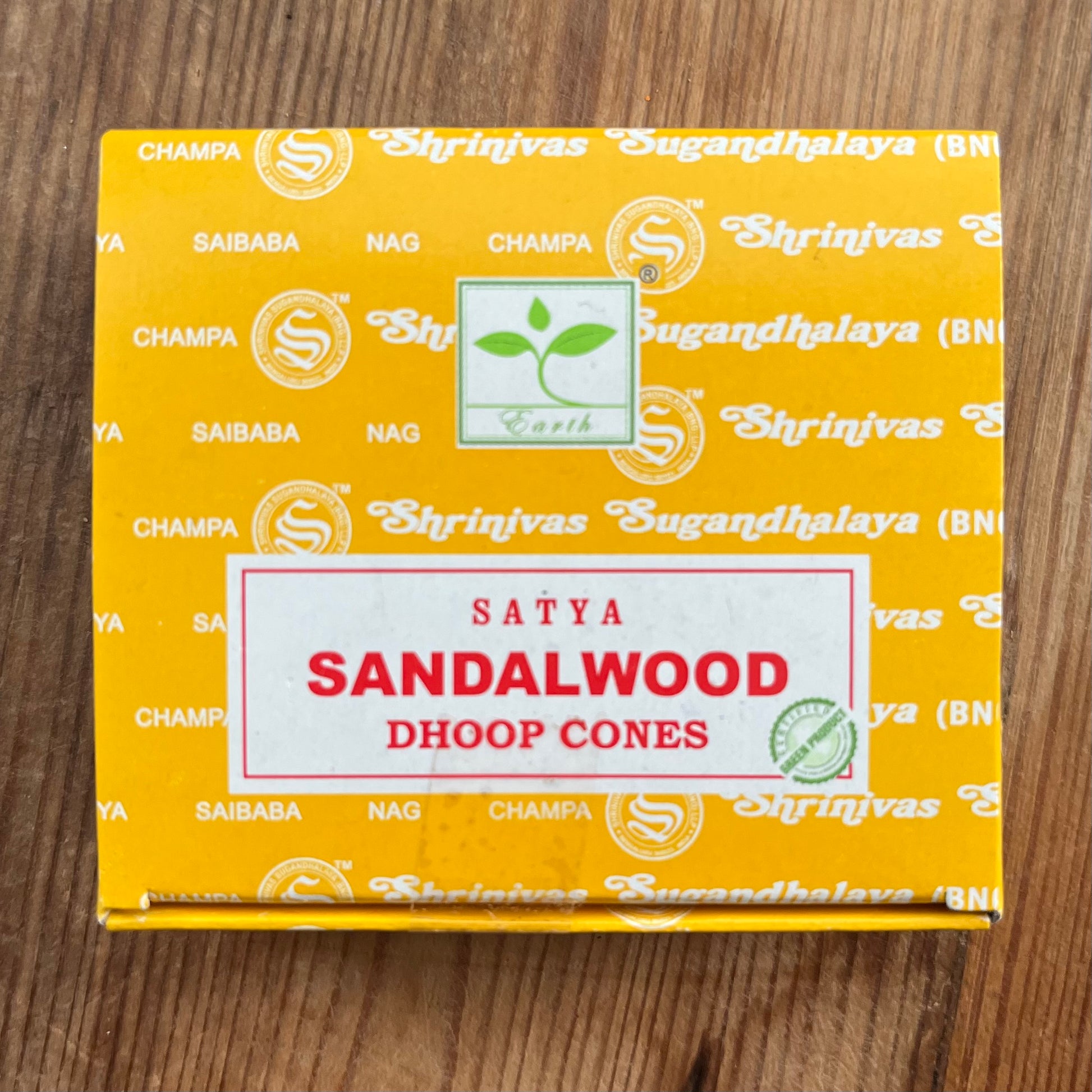 Box of Satya Sandalwood Dhoop incense cones on wooden surface