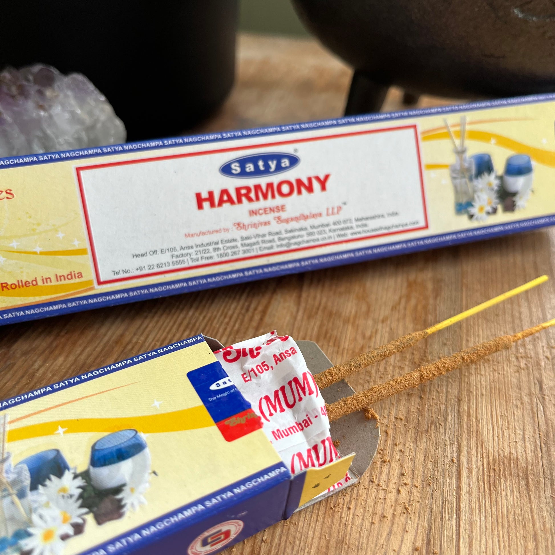Two boxes of Satya Harmony incense from the Yoga Series, presumably containing essential oil incense sticks for meditation and relaxation. one box is open with incense sticks peeking out