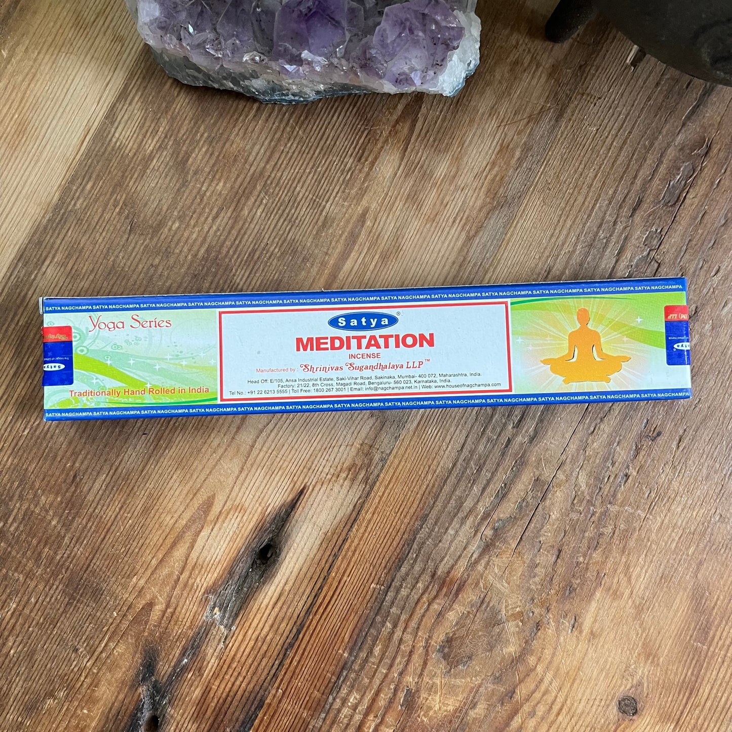 Box of satya meditation incense on wooden table