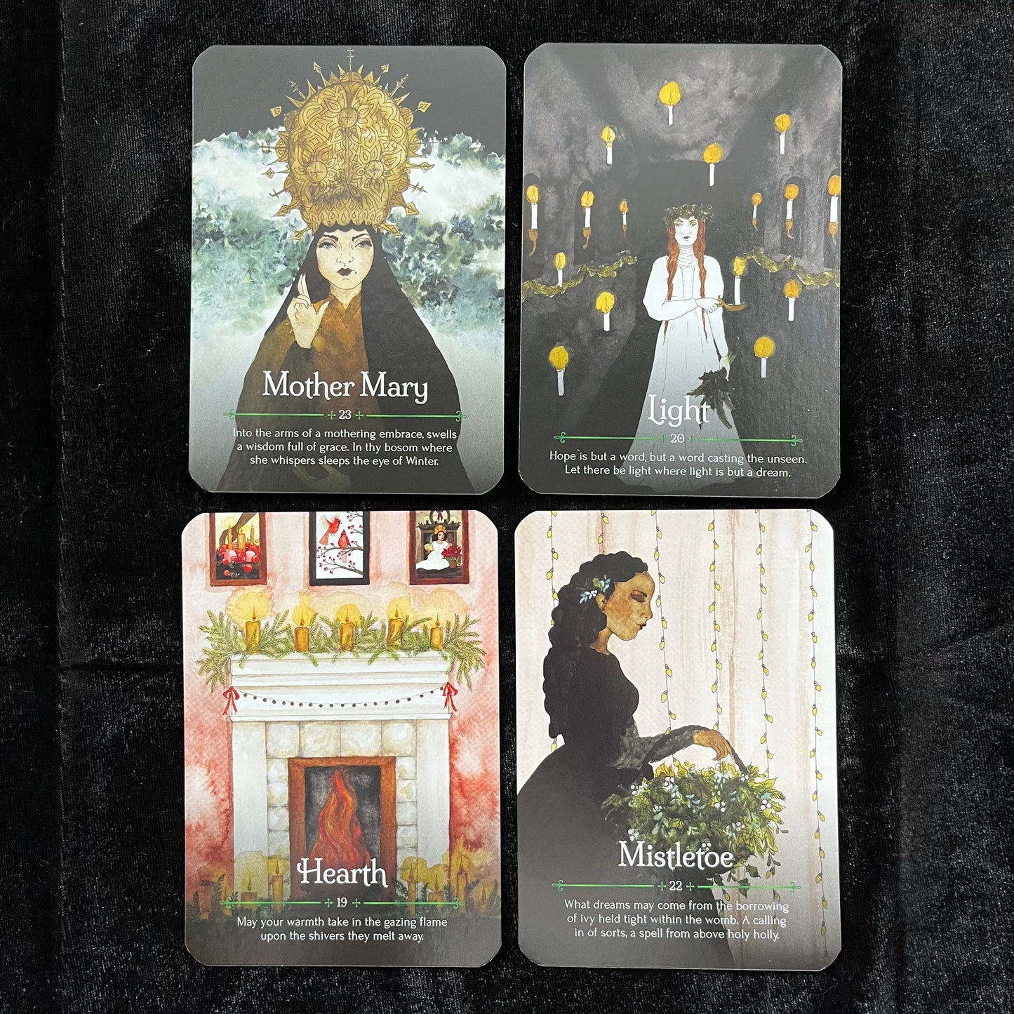 Four tarot cards with illustrations and text on a dark background