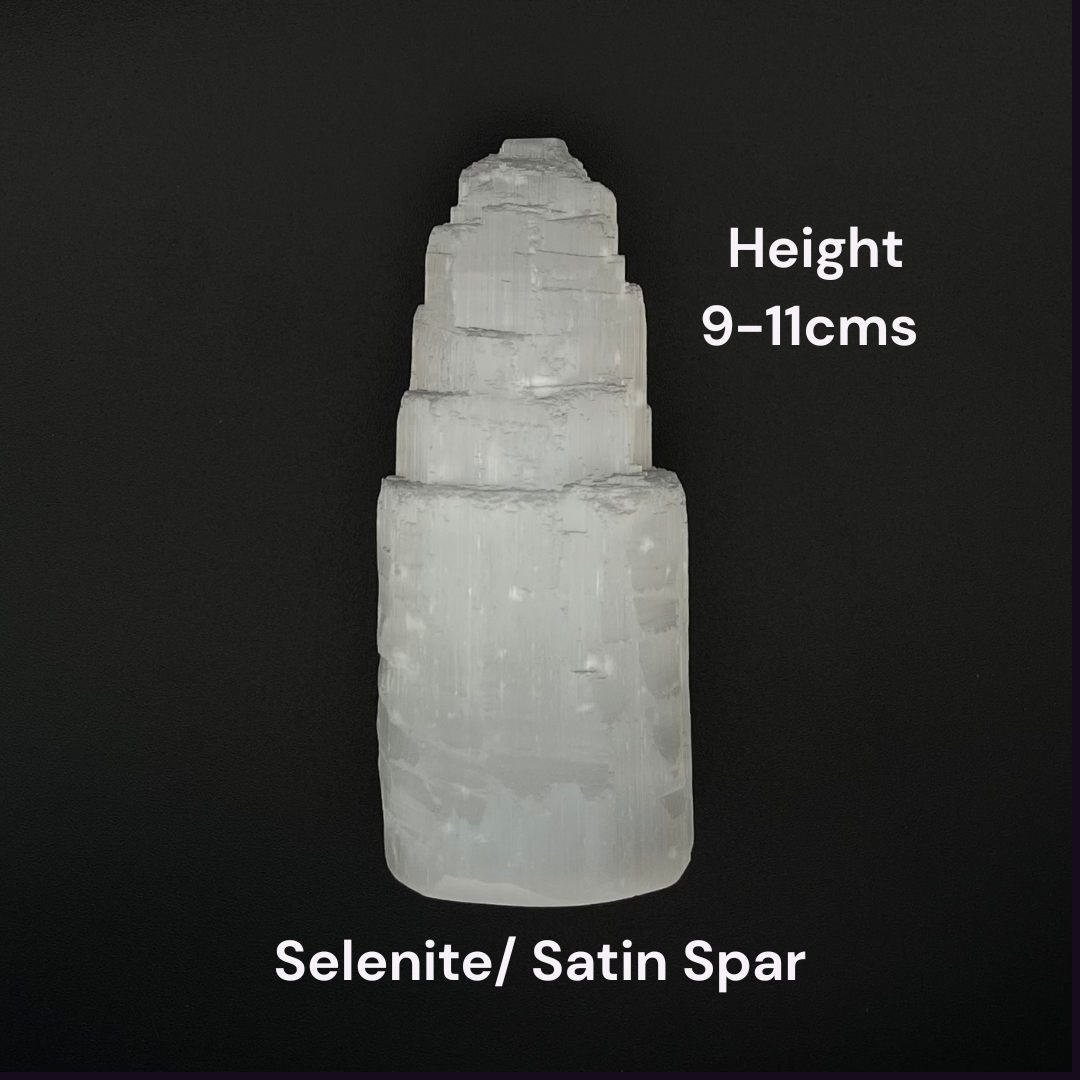A natural selenite satin spar crystal tower shown against a solid black background, with white text overlays indicating its height of 9-11cm and identifying it as Selenite/ Satin Spar.