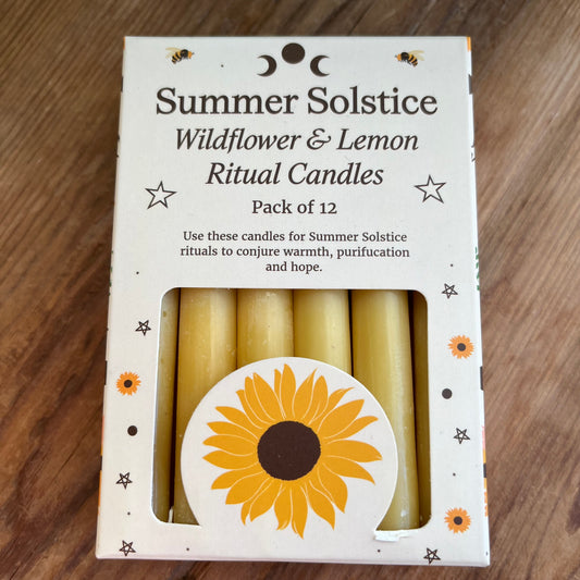 yellow ritual spell candles scented with wildflowers and lemon for the summer solstice 