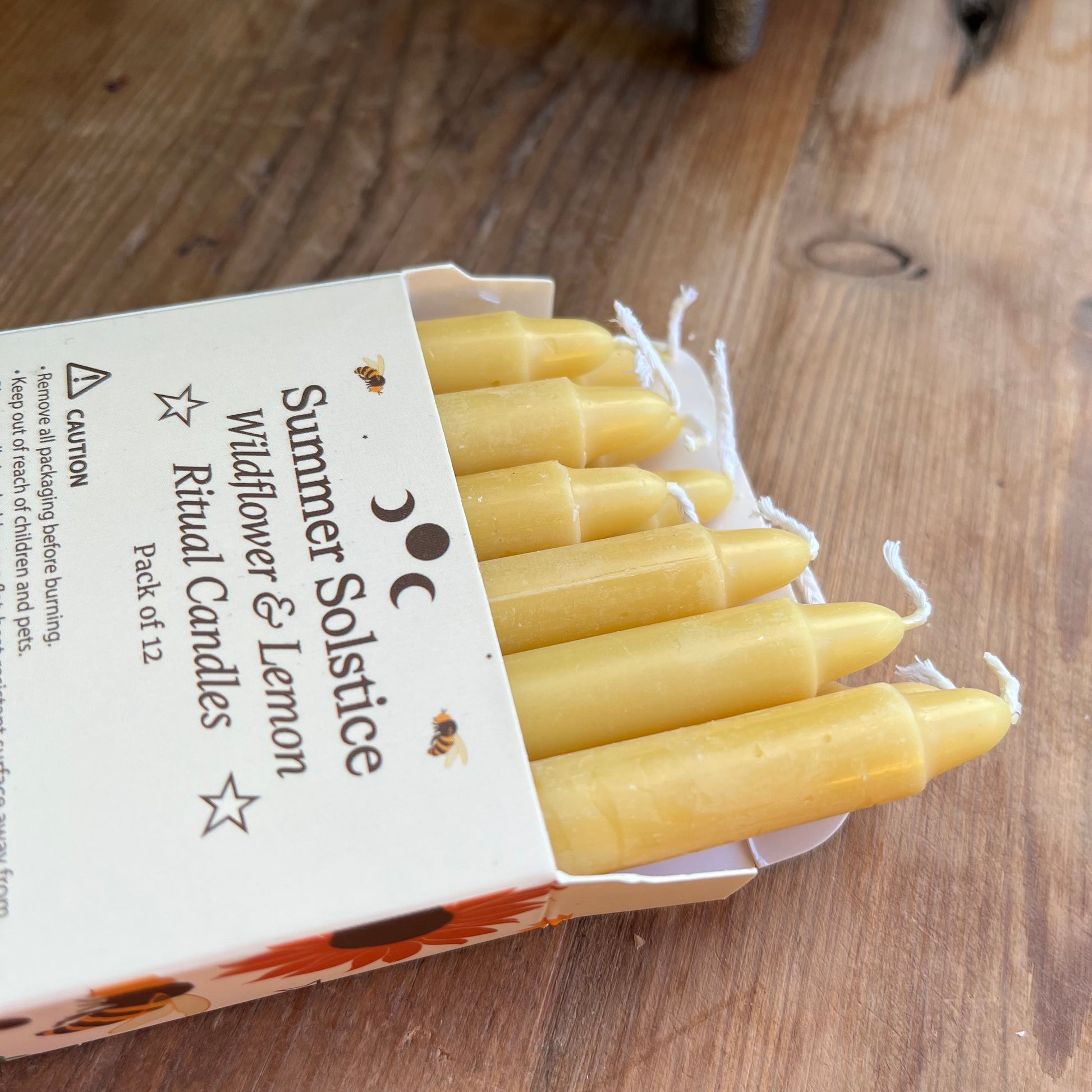 yellow ritual spell candles scented with wildflowers and lemon for the summer solstice 