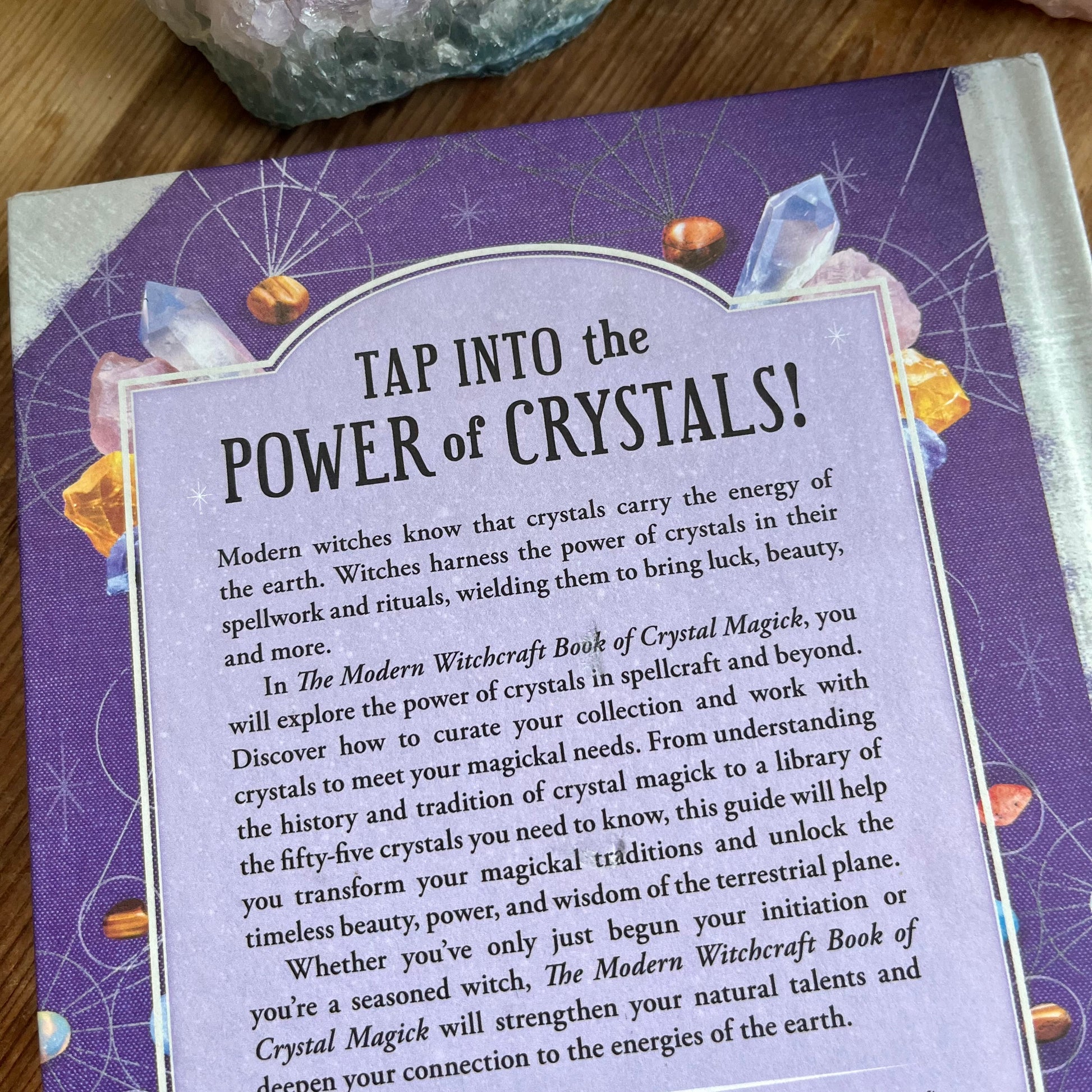 Blorb on the back over ofThe Modern Witchcraft Book of Crystal Magick