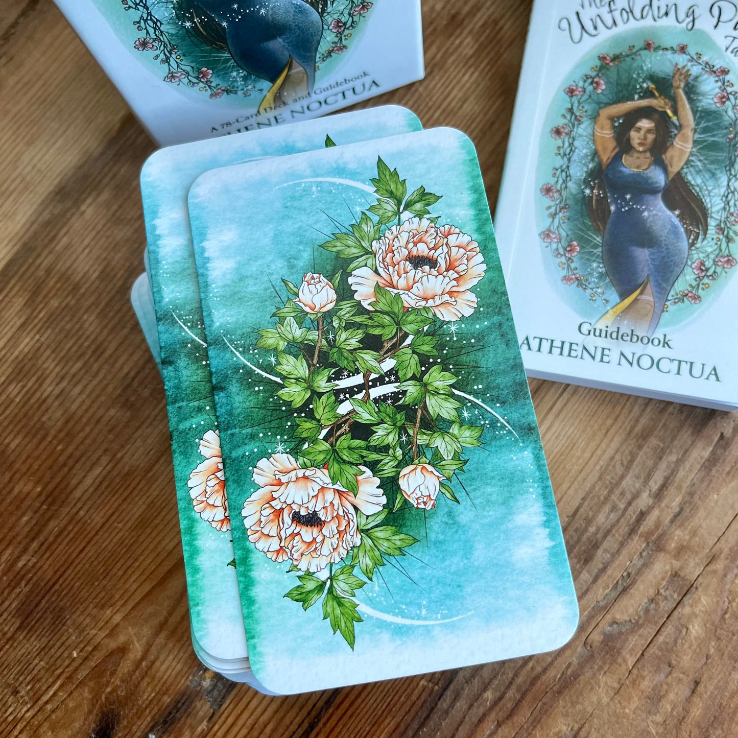 The back of The unfolding Path Tarot   which is a beautiful floral image 