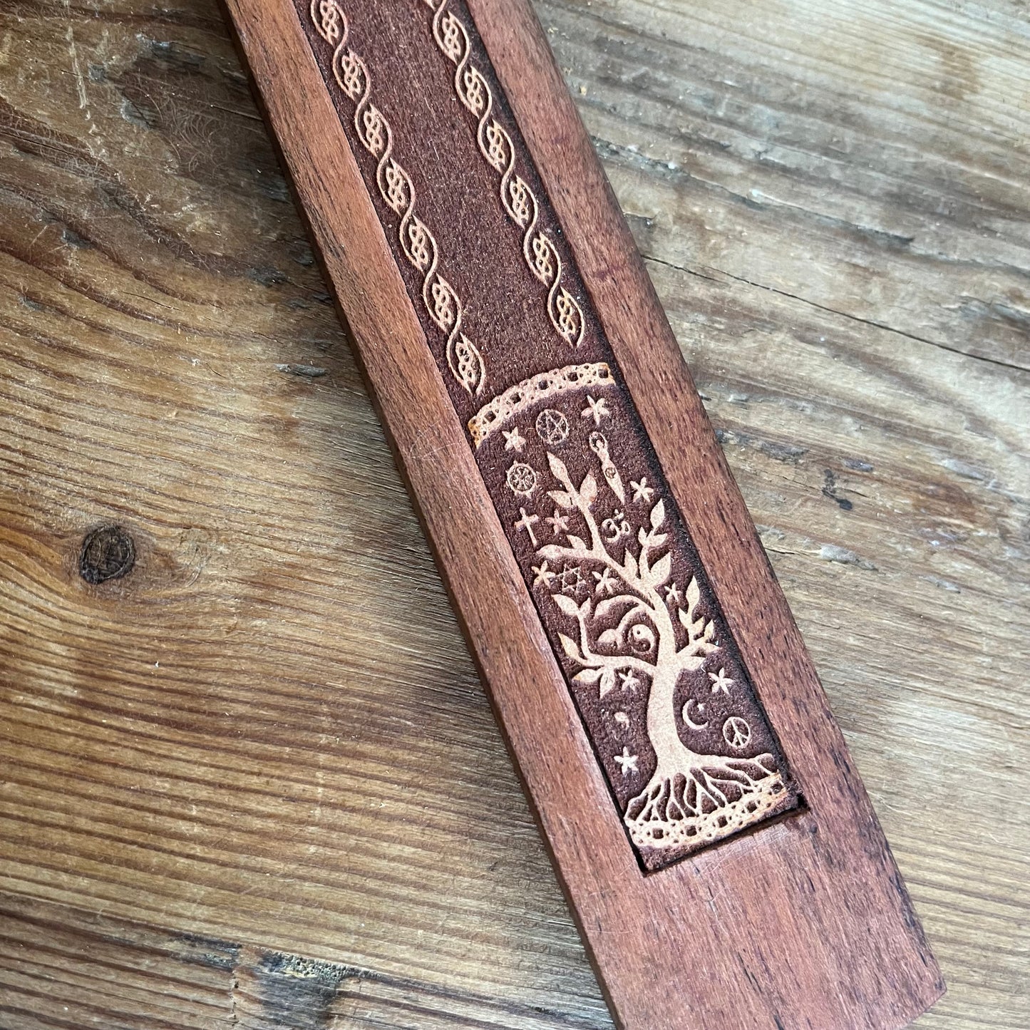 Traditional ski shaped wooden Incense Stick Holder with a tree ornately engraved into the wood 