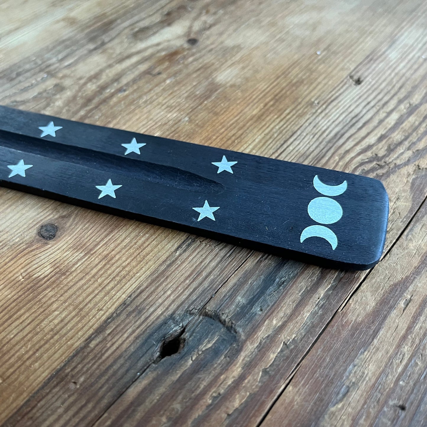 Triple moon wooden incense ash catcher (Black) features a printed triple moon design accented by silver stars.