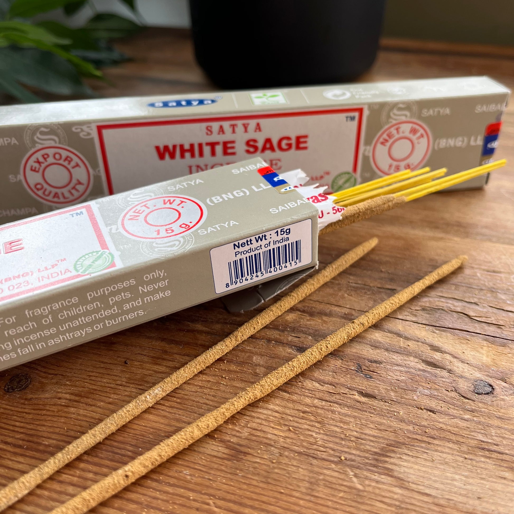 Box of Satya White Sage incense on a wooden surface 