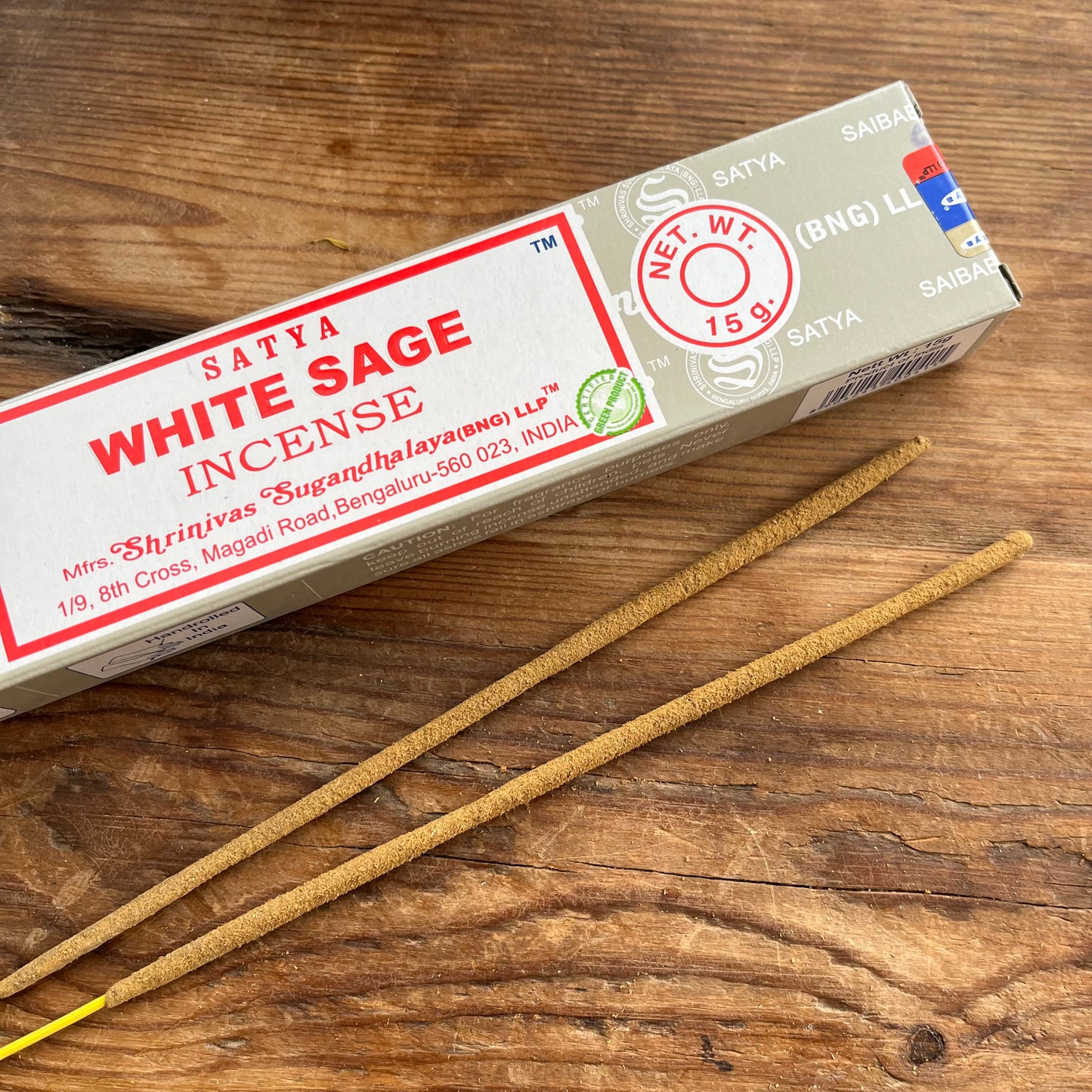 Box of Satya White Sage incense on a wooden surface 