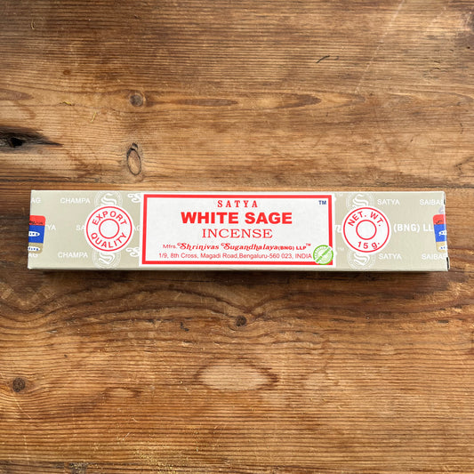 Box of Satya White Sage incense on a wooden surface