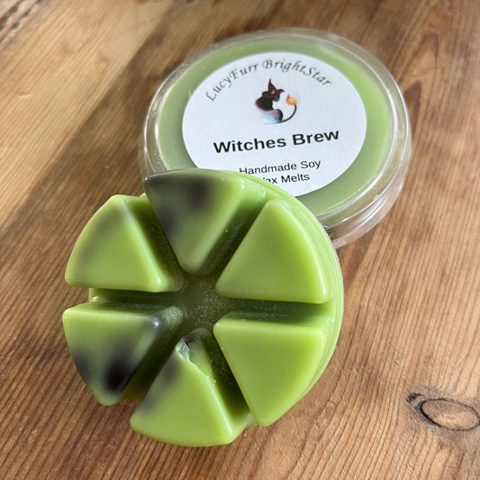 Green wax melts in a mold with a container labeled 'Witches Brew' on a wooden surface.