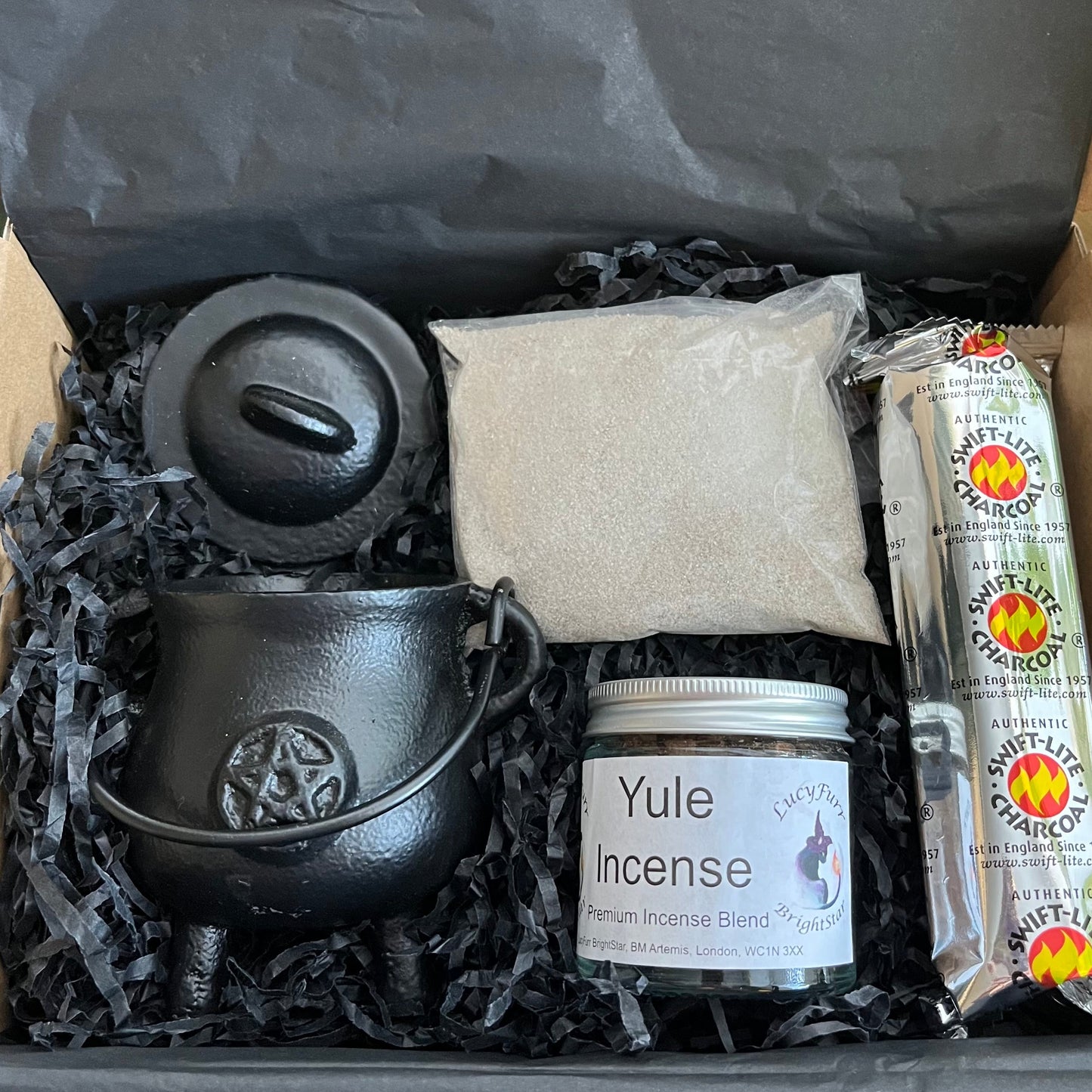 Gift Box containing black cauldron, a jar labeled 'Yule Incense', and other items
