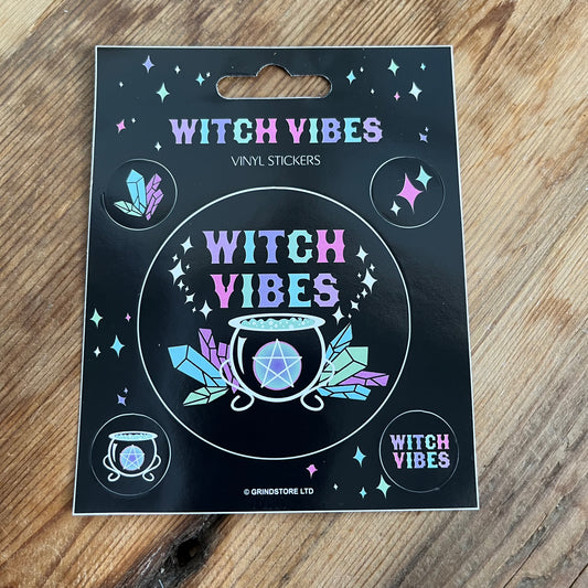 1 Large sticker and 4 smaller stickers. with the words witchy vibes and witchcraft symbols of cauldron, crytals and the words witchy vibes in bright colours. 